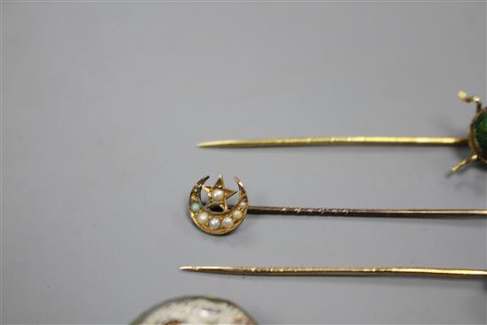 A yellow metal and scarab set stick, three others including Essex crystal style, pearl and pearl and diamond, largest 82mm.